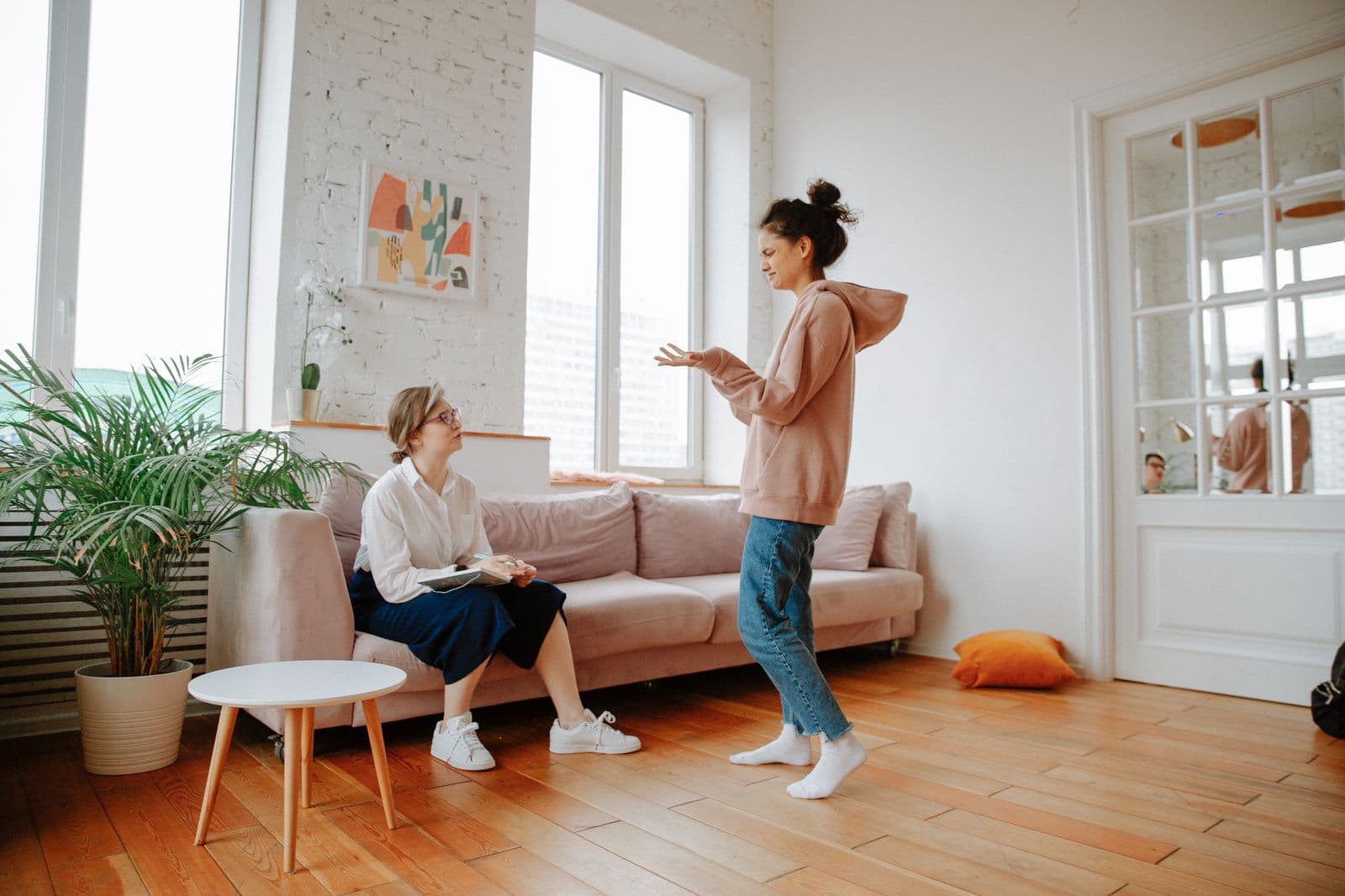 Two women talking together in a calm therapy session